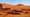 Dunes du Sahara sous ciel clair, paysage désertique lié aux recherches archéologiques sur les anciennes populations nord africaines et la période humide africaine